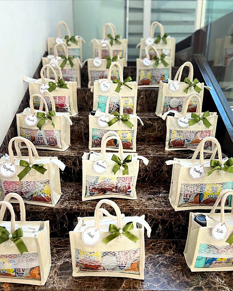 Rows of mini jute gift bags packed by hand at the MADaboutART studio